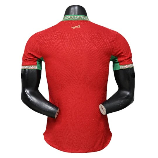 GOATkitz Morocco 2026 player version home jersey in red with green trim and Arabic script detail on the collar.