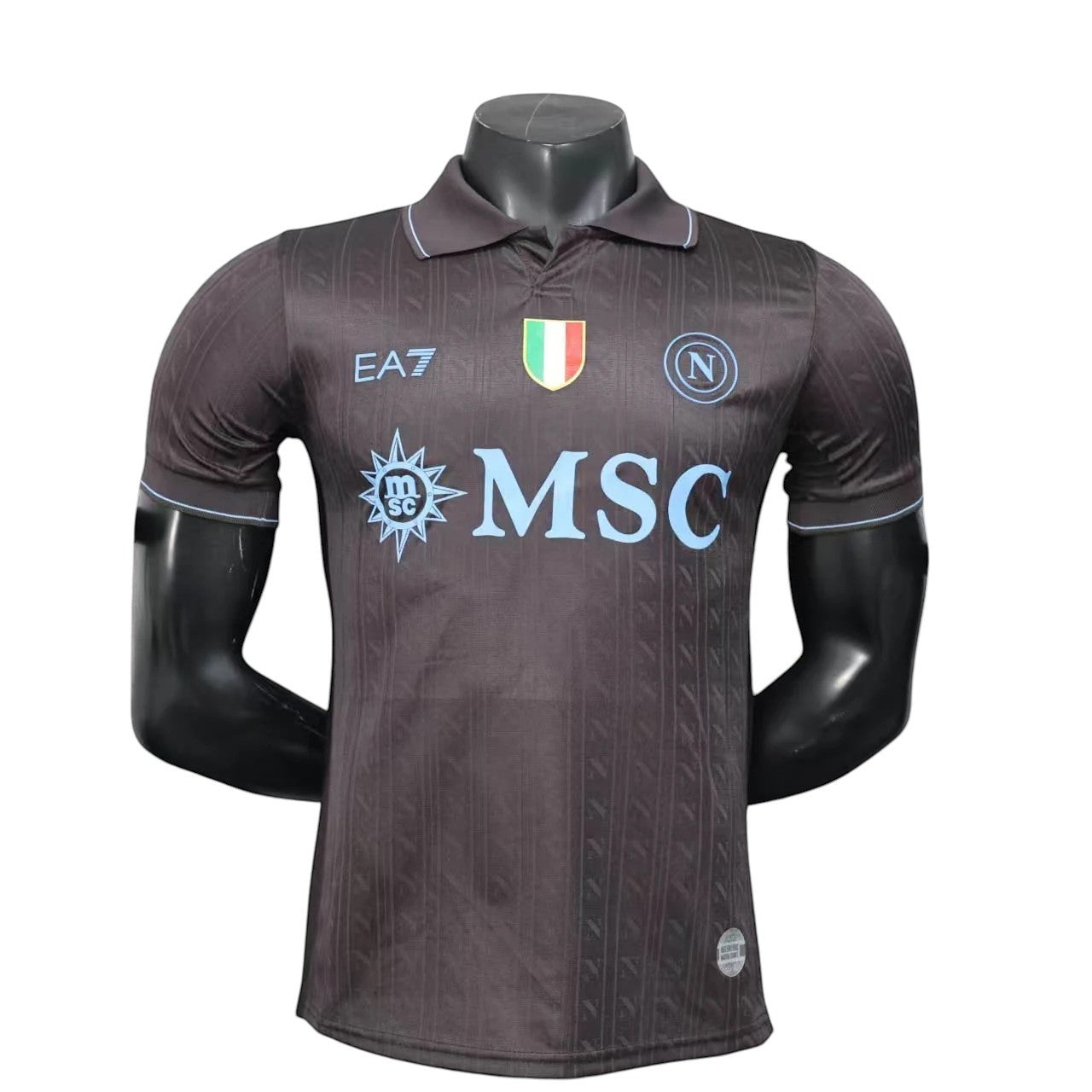 GOATkitz Napoli 2025-26 adult player version third jersey in dark grey with light blue accents and MSC logo.