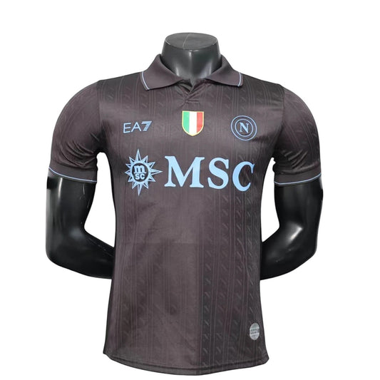GOATkitz Napoli 2025-26 adult player version third jersey in dark grey with light blue accents and MSC logo.