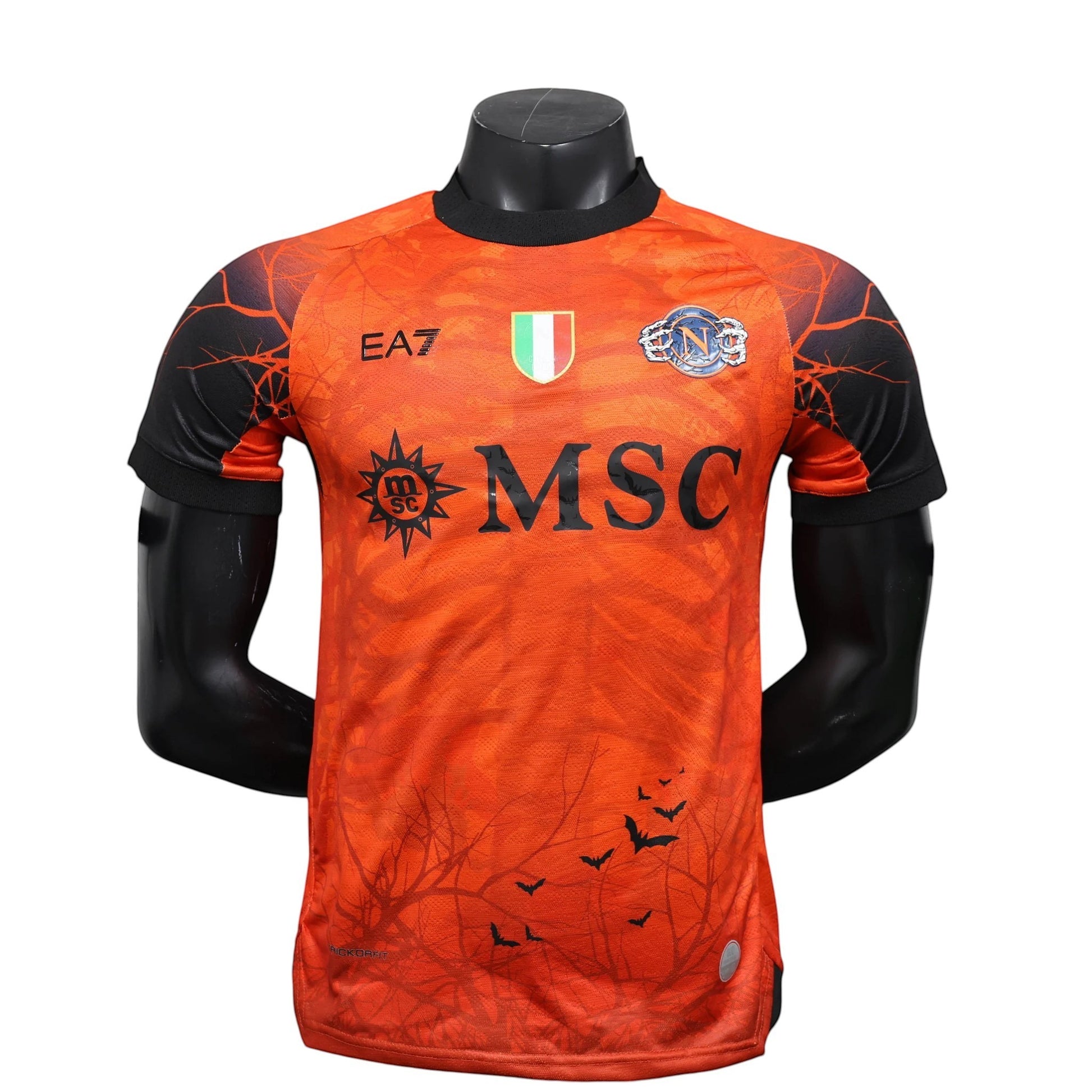GOATkitz Napoli 2025-26 Halloween orange player version jersey with black sleeves and a spooky tree and bat graphic.