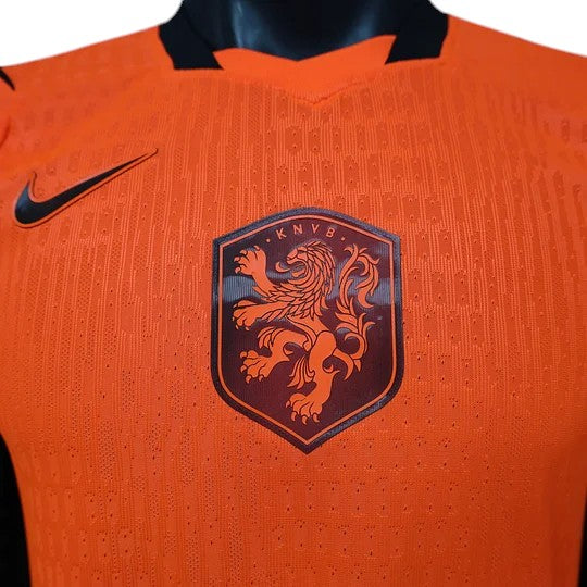 GOATkitz Netherlands 2026 player version home jersey in vibrant orange with black Nike logo and KNVB lion crest.