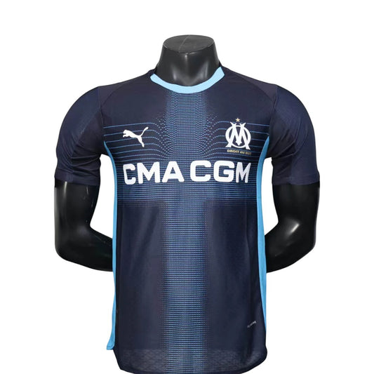 GOATkitz Olympique de Marseille 2025-26 player version away jersey in navy blue with light blue accents and CMA CGM sponsor.