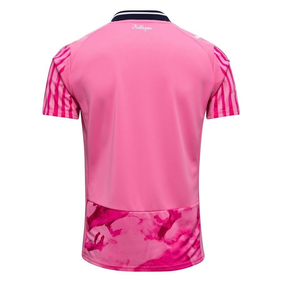GOATkitz pink club jersey with striped sleeves and a marble-like hem detail. Features a navy and white striped collar.
