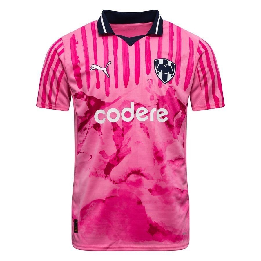 GOATkitz Monterrey pink club World Cup special edition jersey with navy collar and white "codere" sponsor logo. Features vertical stripes on sleeves and abstract pink pattern on body.