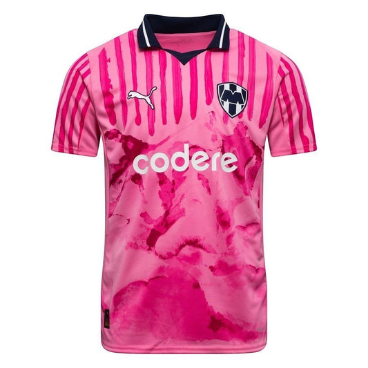 GOATkitz Monterrey pink club World Cup special edition jersey with navy collar and white "codere" sponsor logo. Features vertical stripes on sleeves and abstract pink pattern on body.