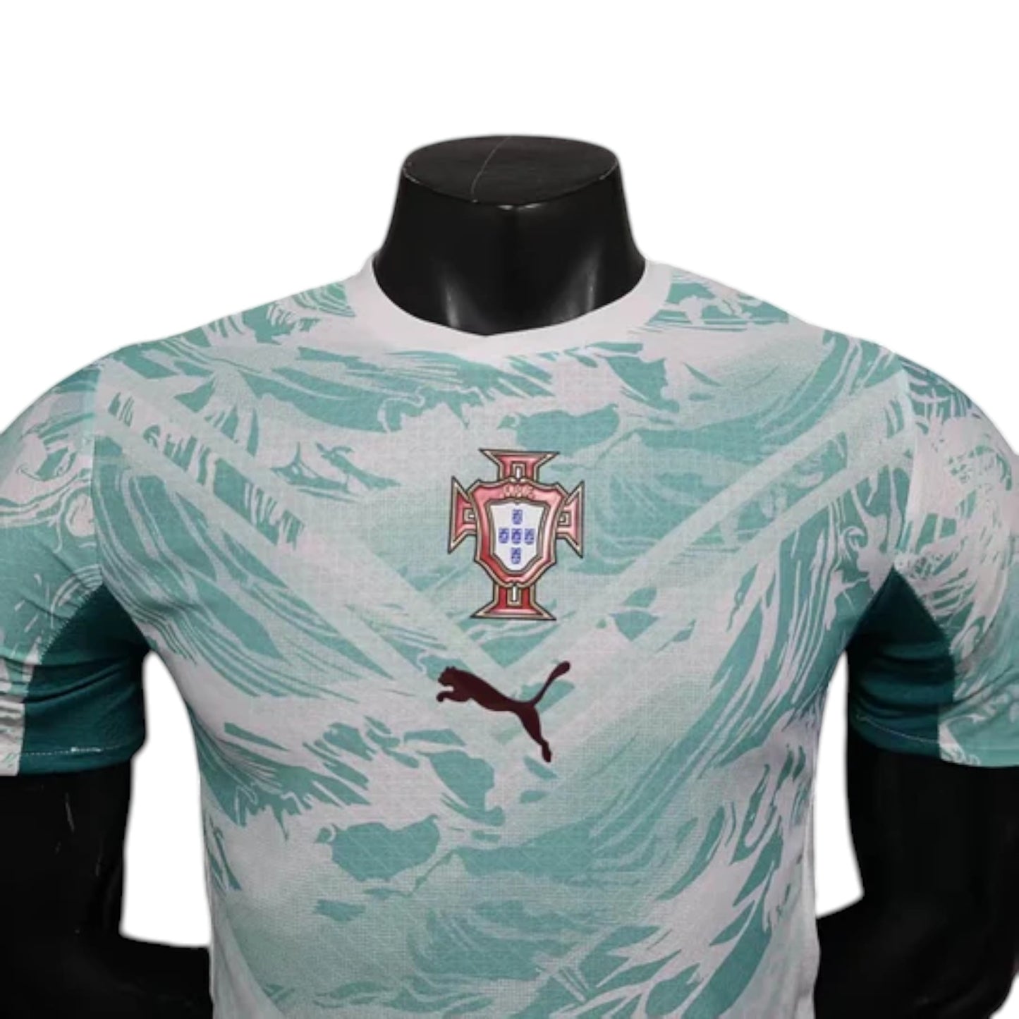 GOATkitz Portugal 2026 player version away jersey in white and mint green with abstract pattern. Features Portugal crest and Puma logo.