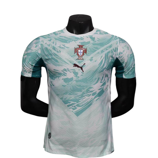 GOATkitz Portugal 2026 player version away jersey in white and teal with abstract pattern. Features Puma logo and Portugal crest.