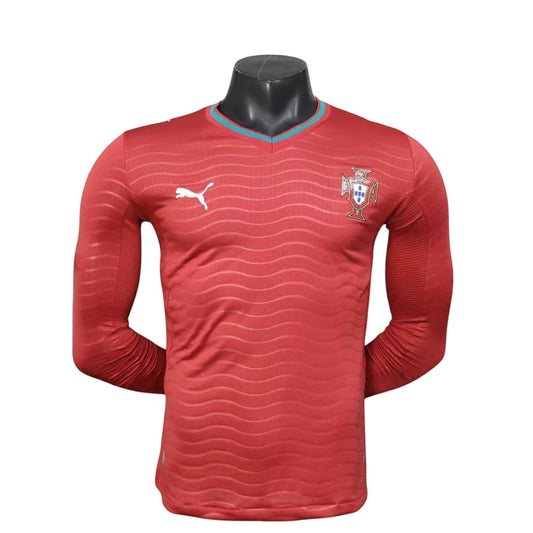 GOATkitz Portugal 2026 long sleeve player version home jersey in red with wavy pattern and teal trim.