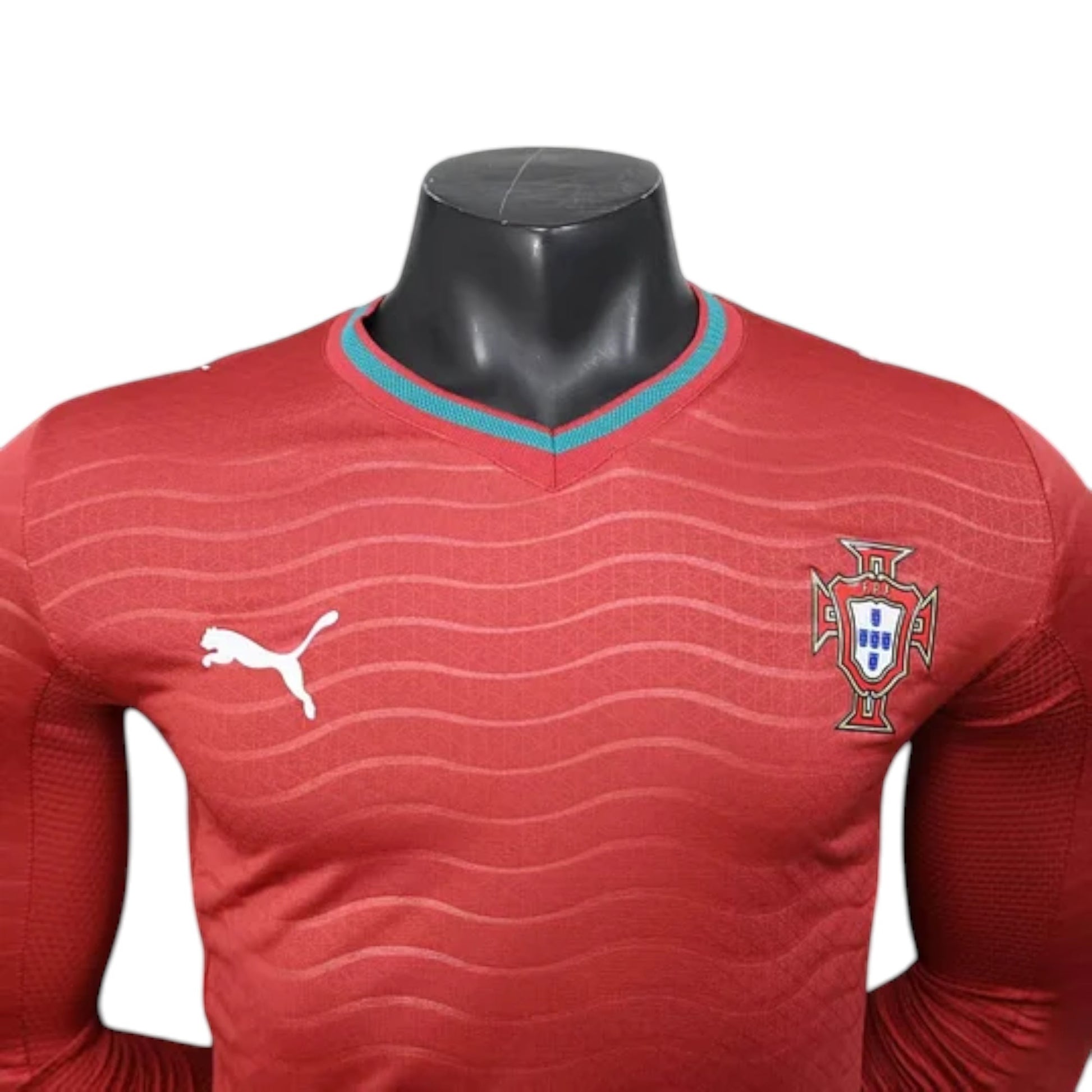 GOATkitz Portugal 2026 red long sleeve player version soccer jersey with teal collar trim and crest.