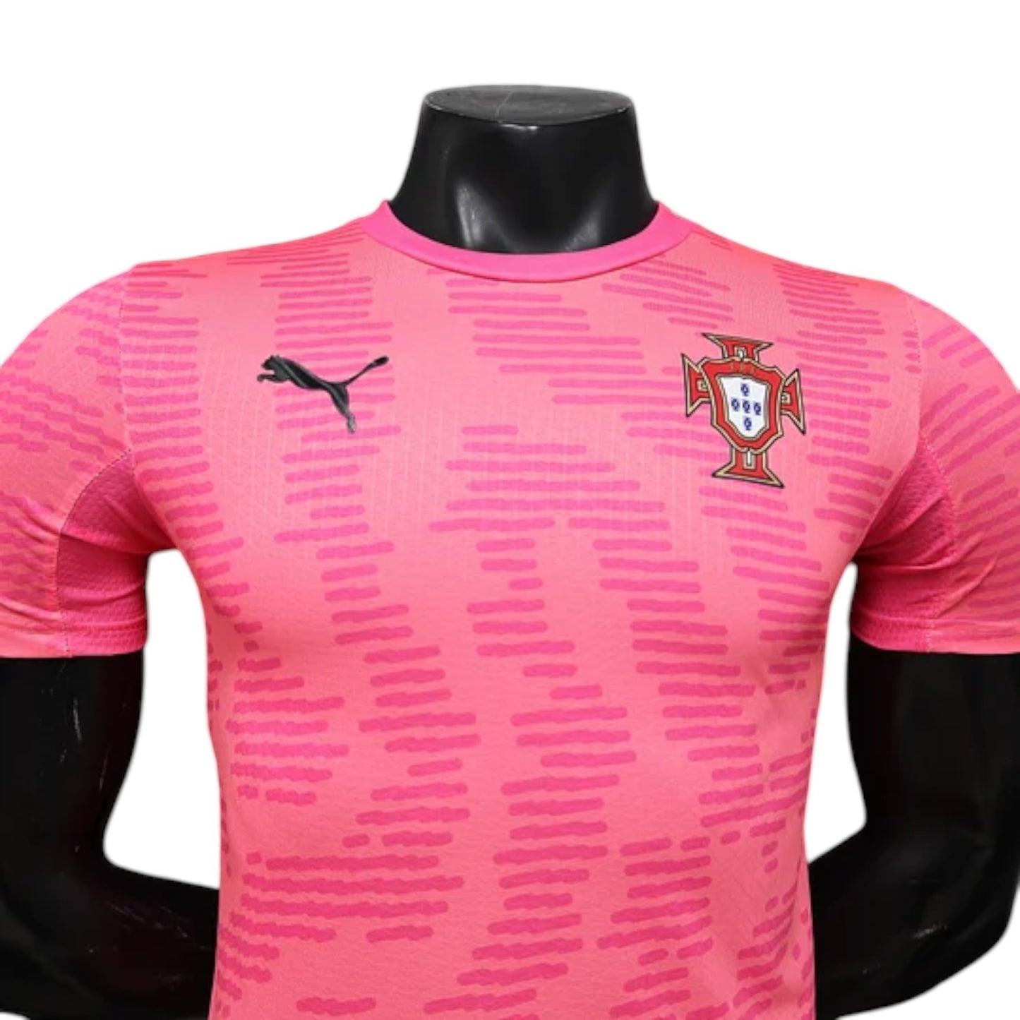 GOATkitz Portugal 2026 pink goalkeeper player version jersey with Puma logo and crest. Features a subtle geometric pattern.