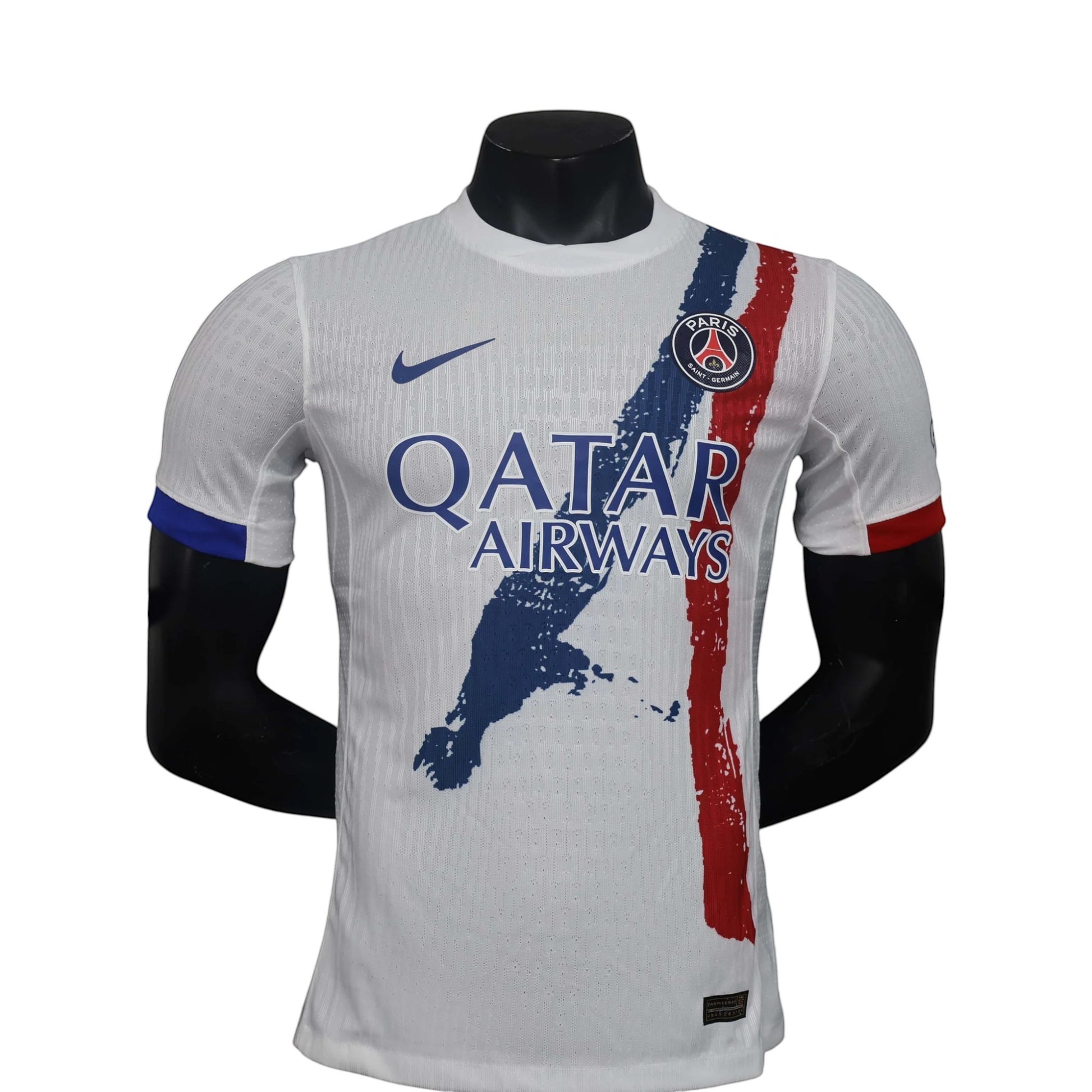 GOATkitz white PSG 2024-25 player version away jersey with blue and red brushstroke design, Qatar Airways sponsor.
