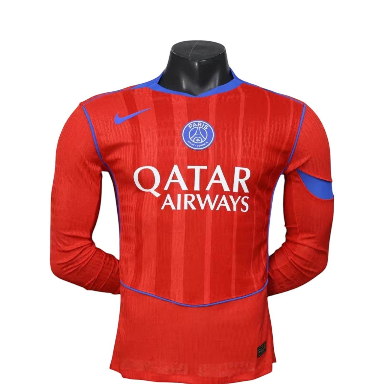 GOATkitz Paris Saint-Germain 2025-26 player version third long sleeve jersey in red with blue accents. Features Qatar Airways sponsor.