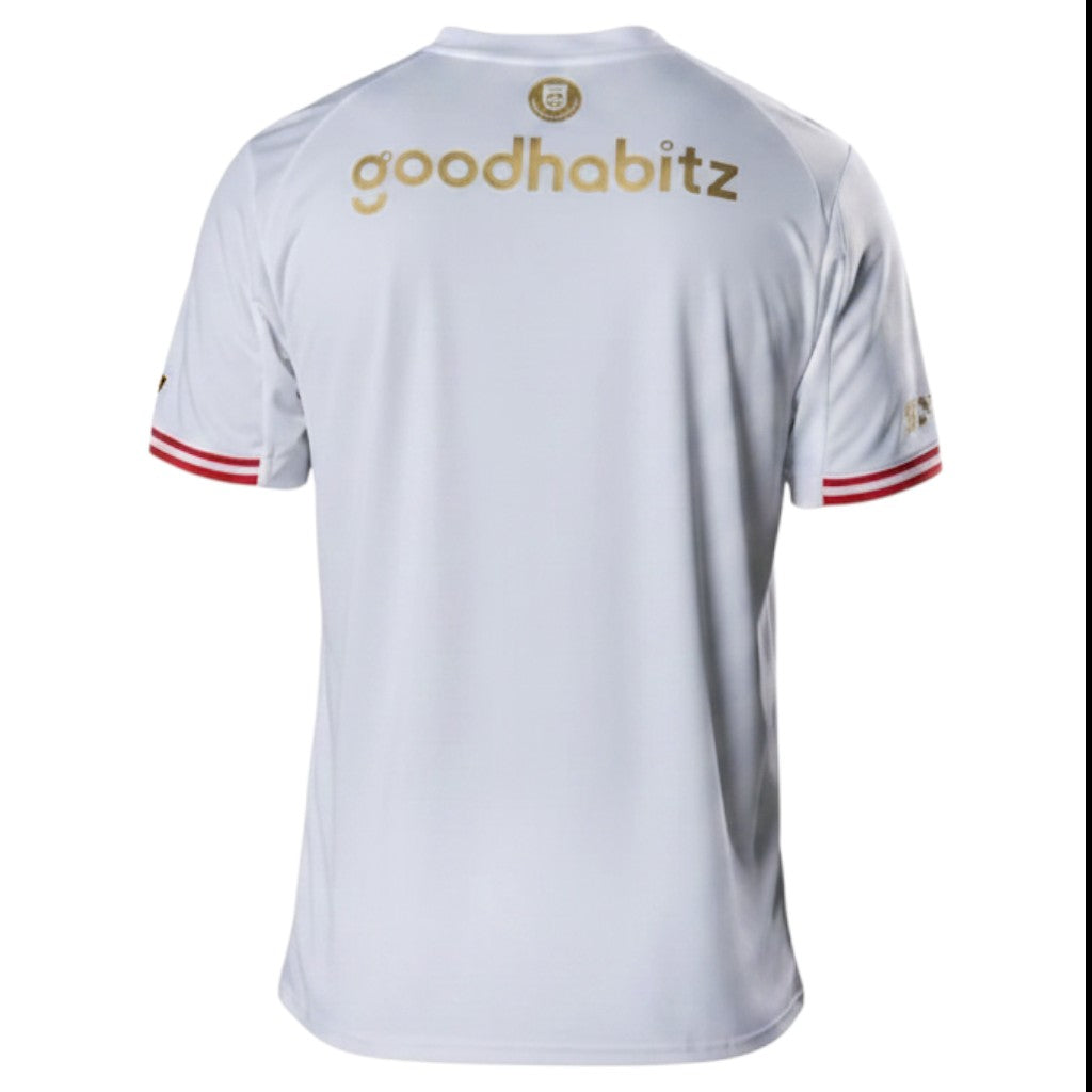 GOATkitz PSV Eindhoven white special edition kids jersey with gold 'goodhabitz' logo and red trim on sleeves.