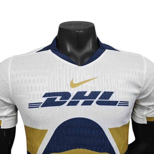 GOATkitz Pumas UNAM 2025-26 player version home jersey, white with navy and gold accents, customizable name and number.