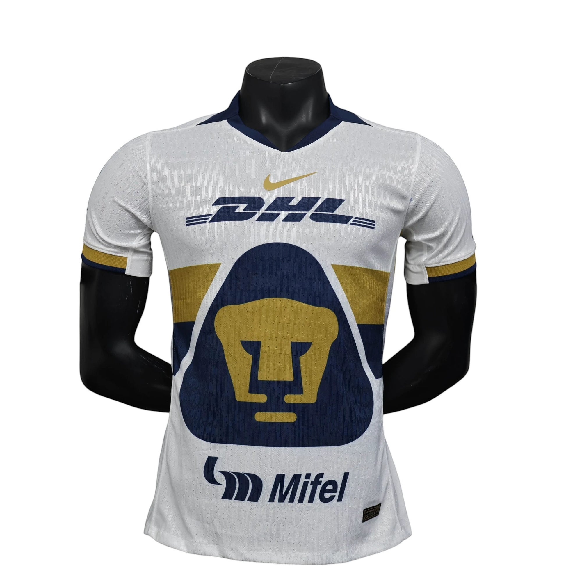 GOATkitz Pumas UNAM 2025-26 player version white football jersey with navy and gold accents, DHL logo, and Pumas crest.