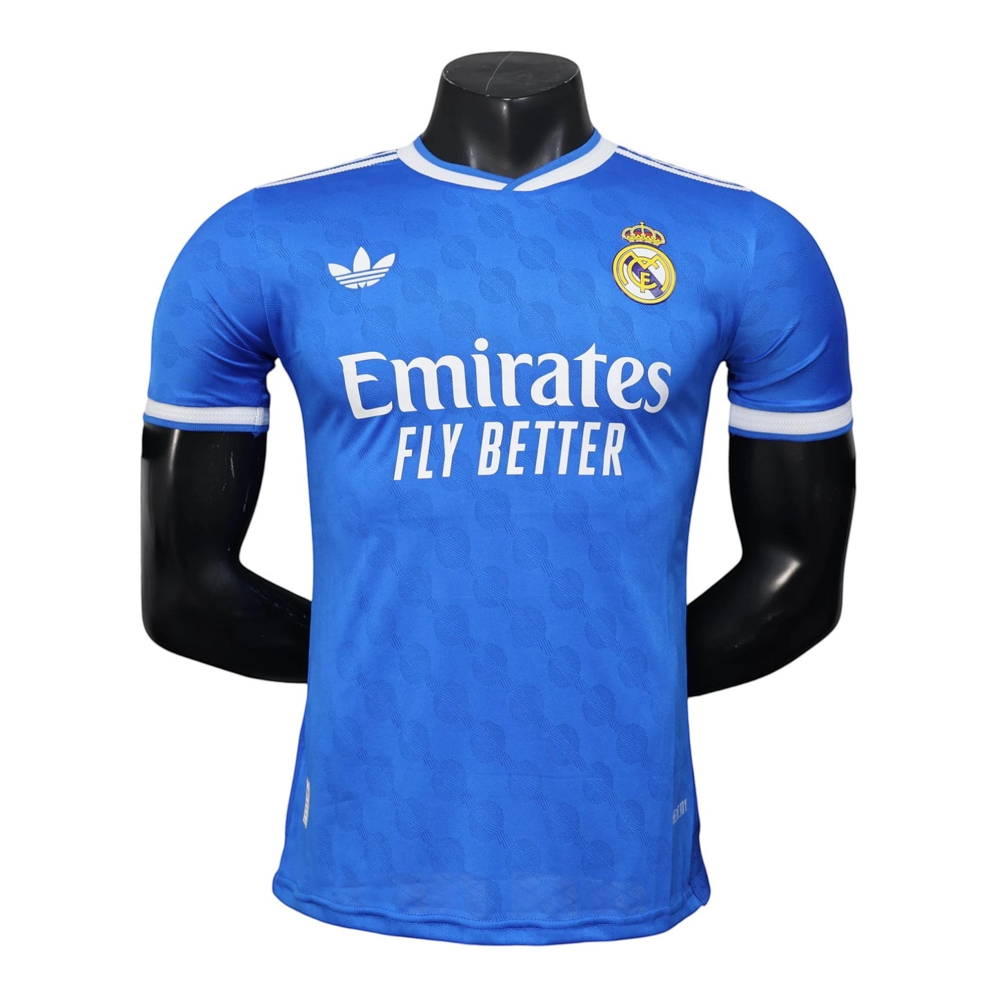 GOATkitz Real Madrid 2025-26 blue player version third jersey with white trim and Emirates Fly Better sponsor. Customizable.