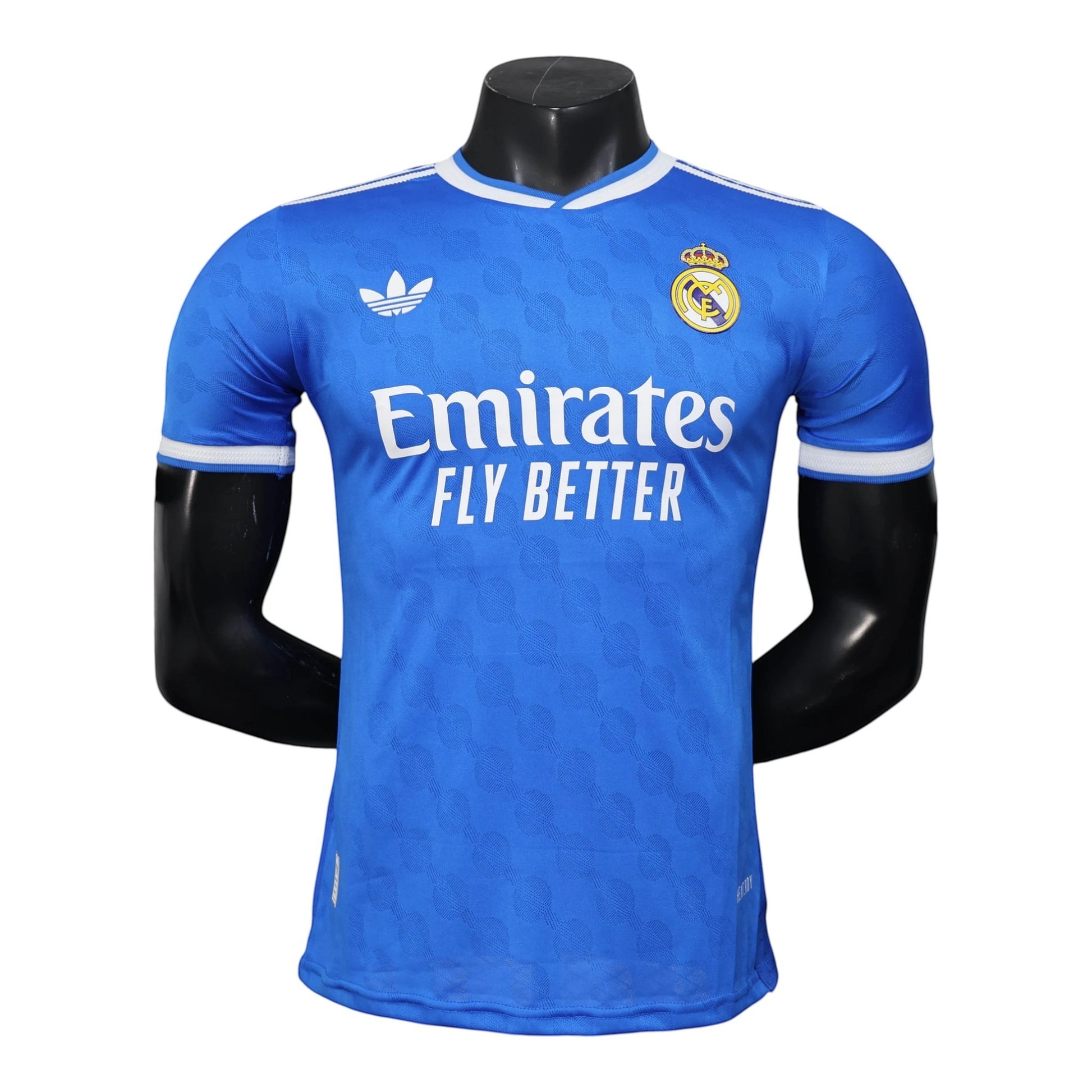 GOATkitz Real Madrid 2025-26 blue player version third jersey with white trim and Emirates Fly Better sponsor. Customizable.
