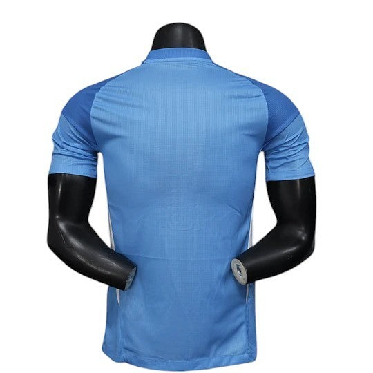 GOATkitz Real Madrid 2025-26 goalkeeper blue player version jersey with contrasting darker blue sleeves and white side panels.
