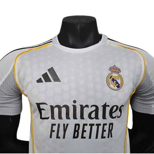 GOATkitz Real Madrid 2025-26 white player version home jersey with yellow trim and customisable badges.
