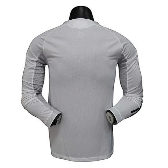 GOATkitz Real Madrid 2025-26 player version home long sleeve jersey in white with grey accents on sleeves. Customizable.