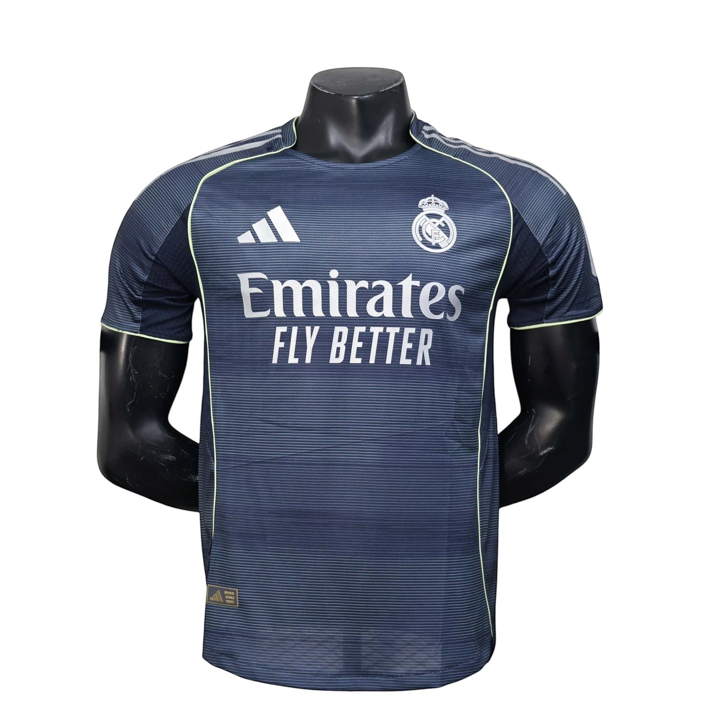 GOATkitz Real Madrid 2025-26 adult player version away jersey in navy blue with white Emirates Fly Better logo and Adidas stripes.