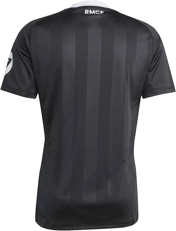 GOATkitz Real Madrid 2025-26 black kids goalkeeper jersey with vertical stripes and white RM CF collar detail.