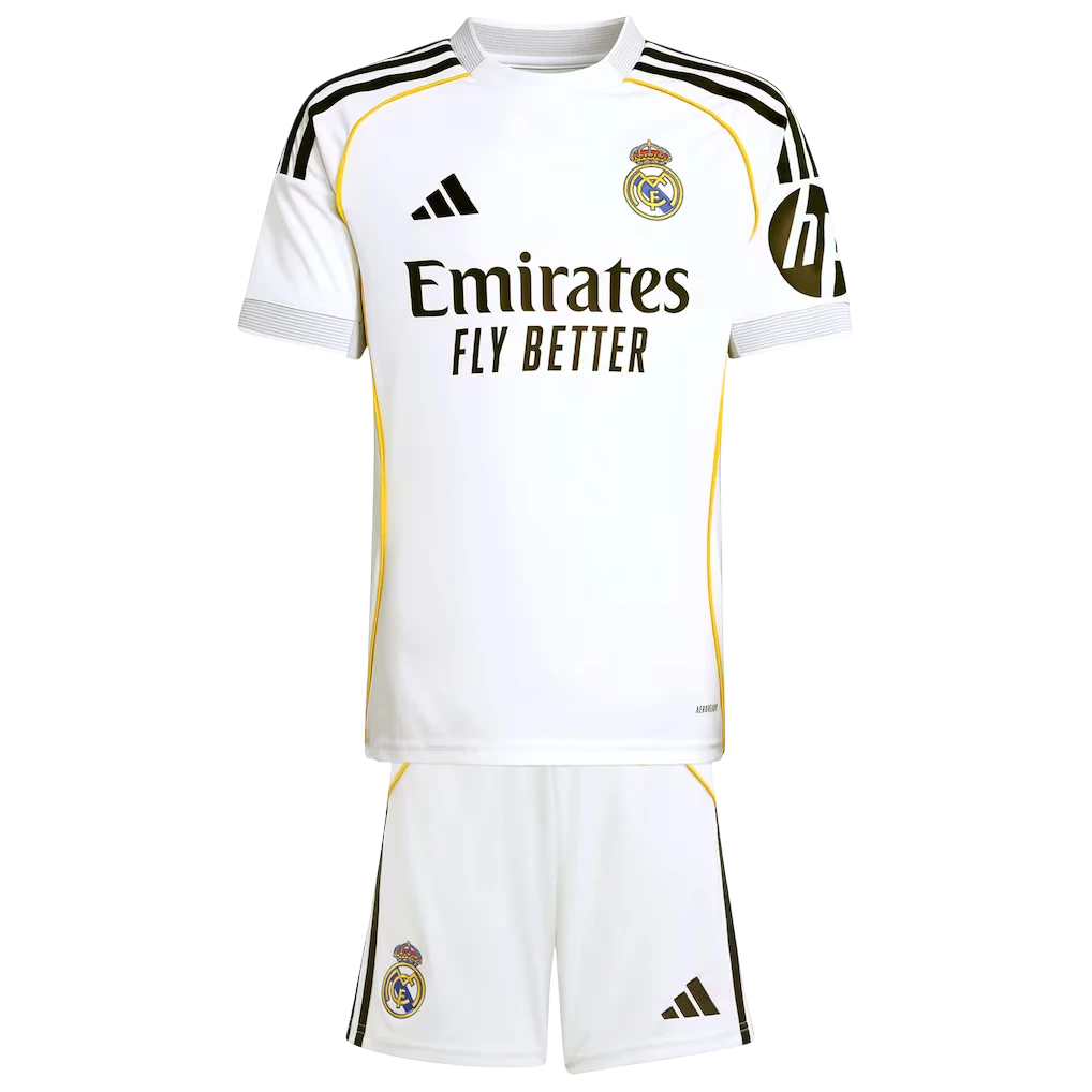 GOATkitz Real Madrid 2025-26 kids white football jersey and shorts set with yellow trim and black stripes.