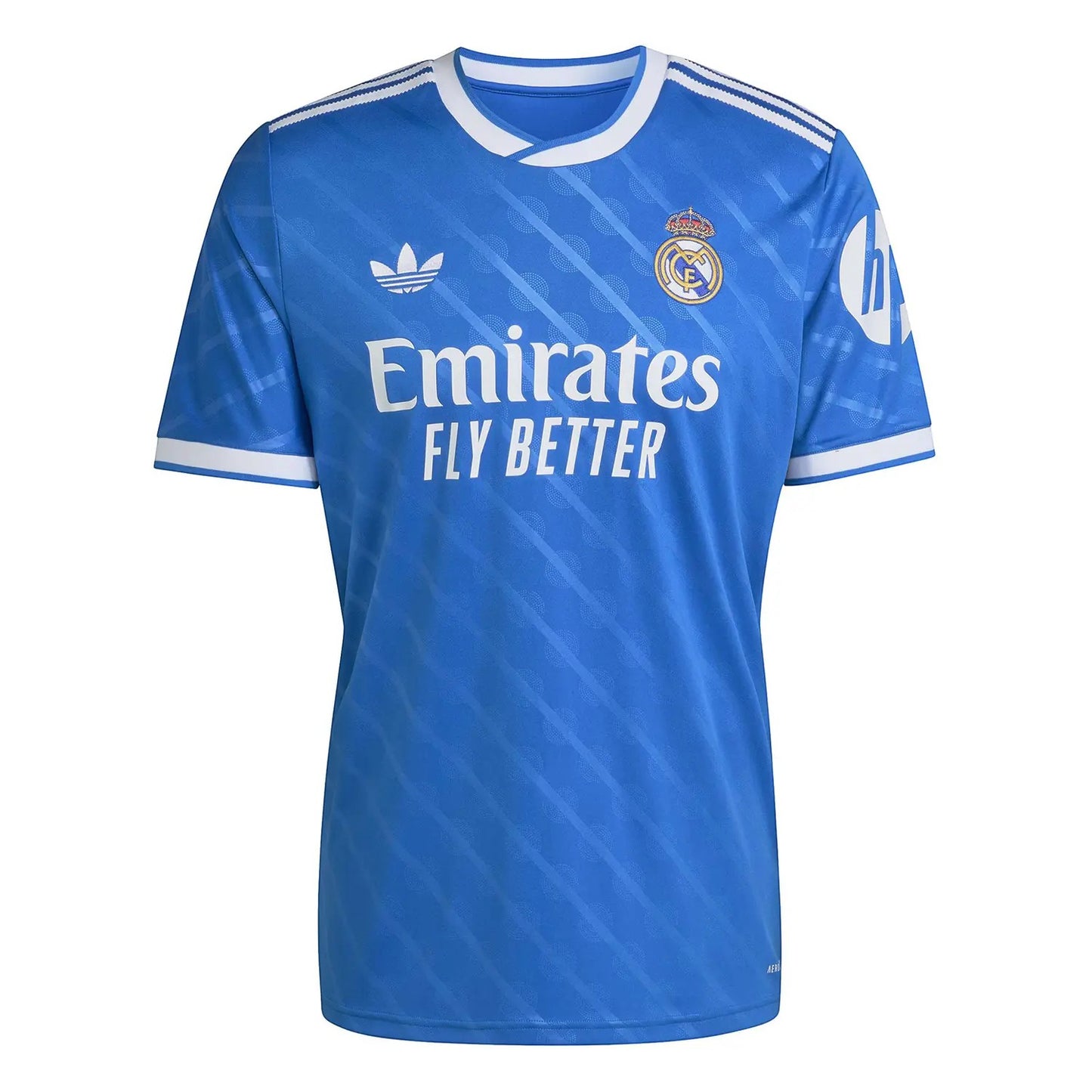 GOATkitz Real Madrid 2025-26 kids third jersey in bright blue with white trim, featuring Emirates Fly Better sponsor and club crest.