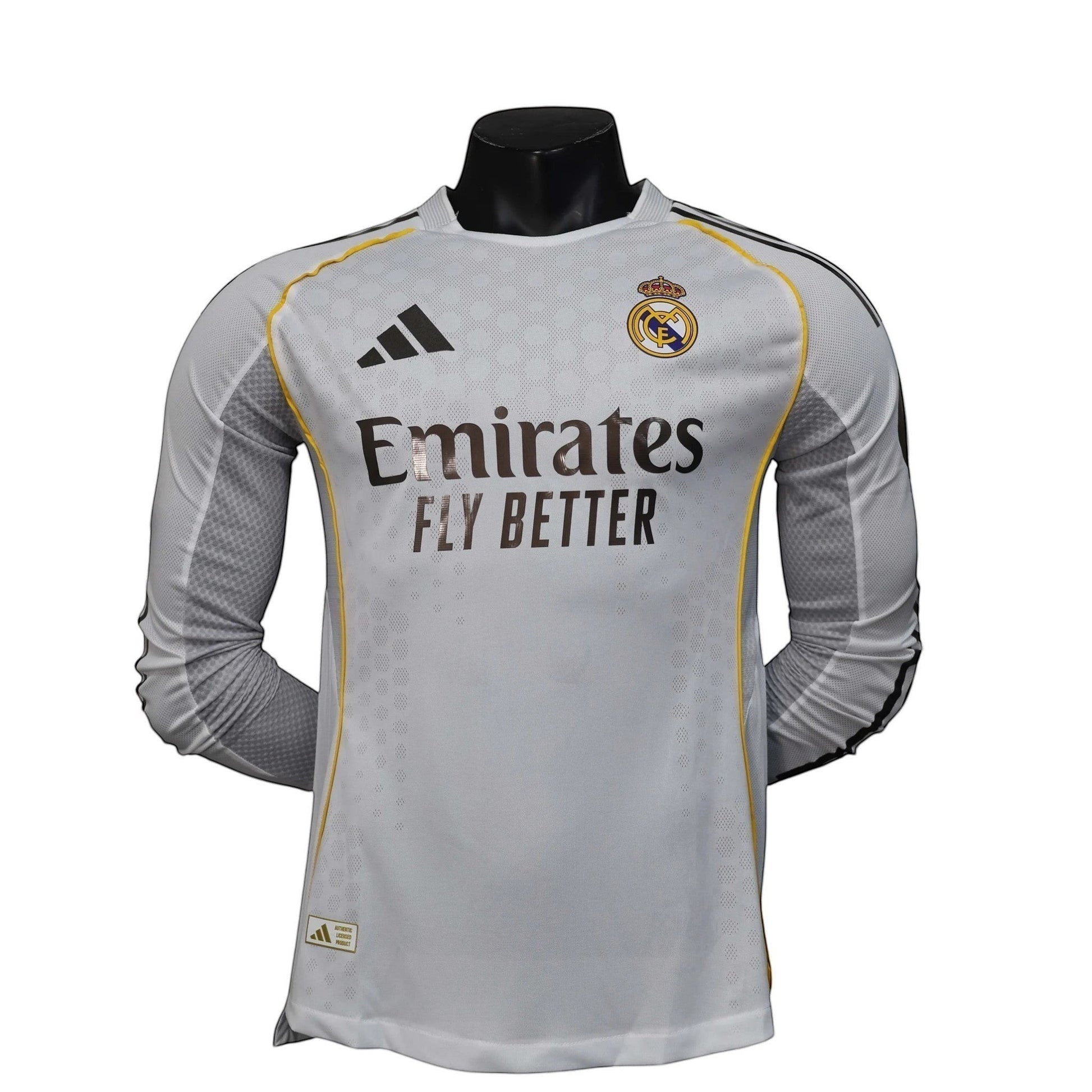 GOATkitz Real Madrid 2025-26 player version long sleeve jersey in light grey with yellow trim and Emirates Fly Better sponsor.