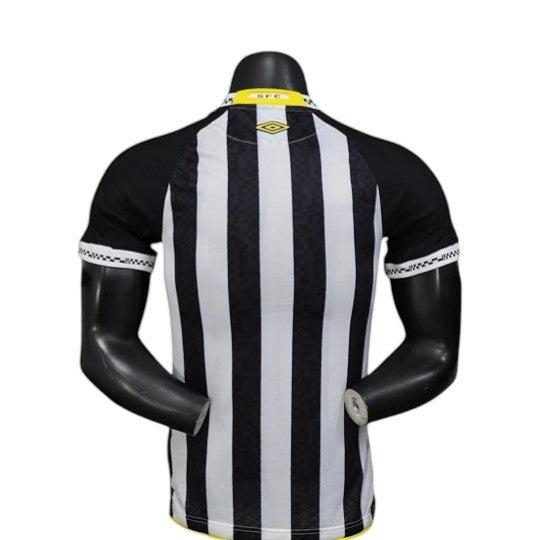 GOATkitz Santos 2025-26 player version away jersey, black and white vertical stripes, black sleeves, yellow collar detail.