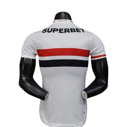 GOATkitz São Paulo 2025-26 player version home jersey, white with red and black horizontal stripes, customizable name and number.
