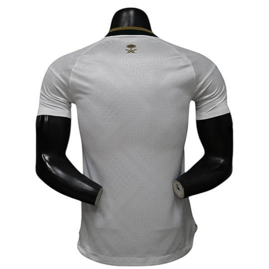 GOATkitz Saudi Arabia 2026 player version away jersey in white with gold emblem on the back and green collar.
