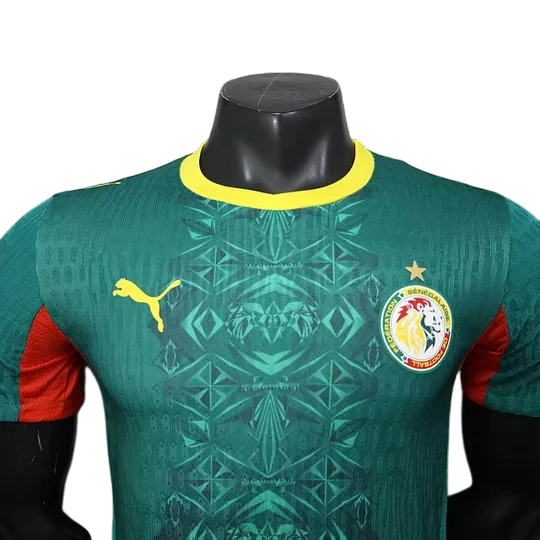 GOATkitz Senegal 2026 player version away jersey in green with yellow trim and red accents. Features Puma logo and Senegal crest.