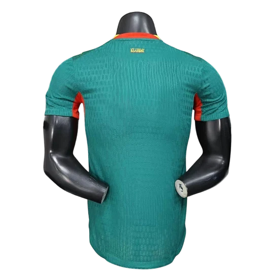 GOATkitz Senegal 2026 player version away jersey in green with red accents on the collar and sleeves. Features a textured pattern.