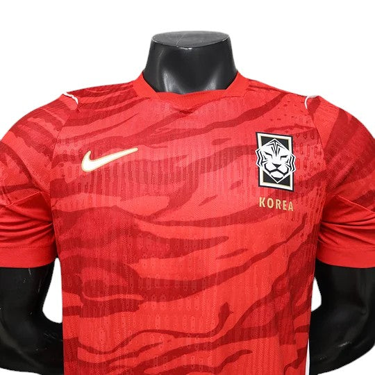 GOATkitz South Korea 2026 player version home jersey in red with tiger stripe pattern and white Nike logo.