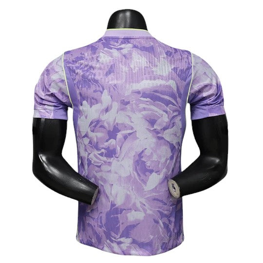 GOATkitz South Korea 2026 Player Version Away Jersey in purple with a floral pattern. Short sleeves, crew neck, and lime green trim.