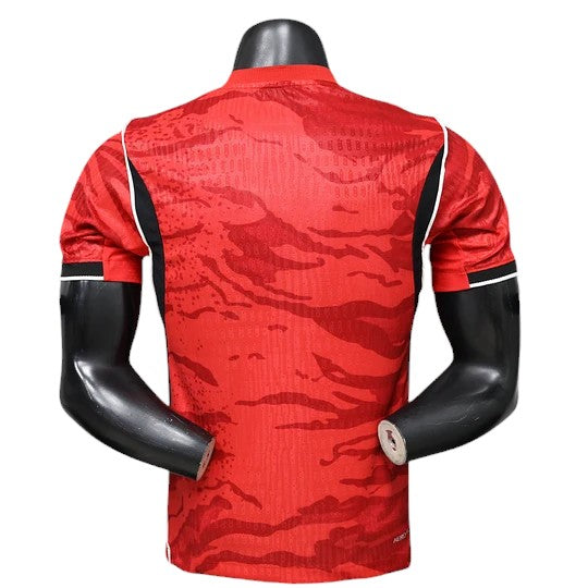 GOATkitz South Korea 2026 Player Version Home Jersey, red with abstract tiger stripe pattern and white trim on sleeves.
