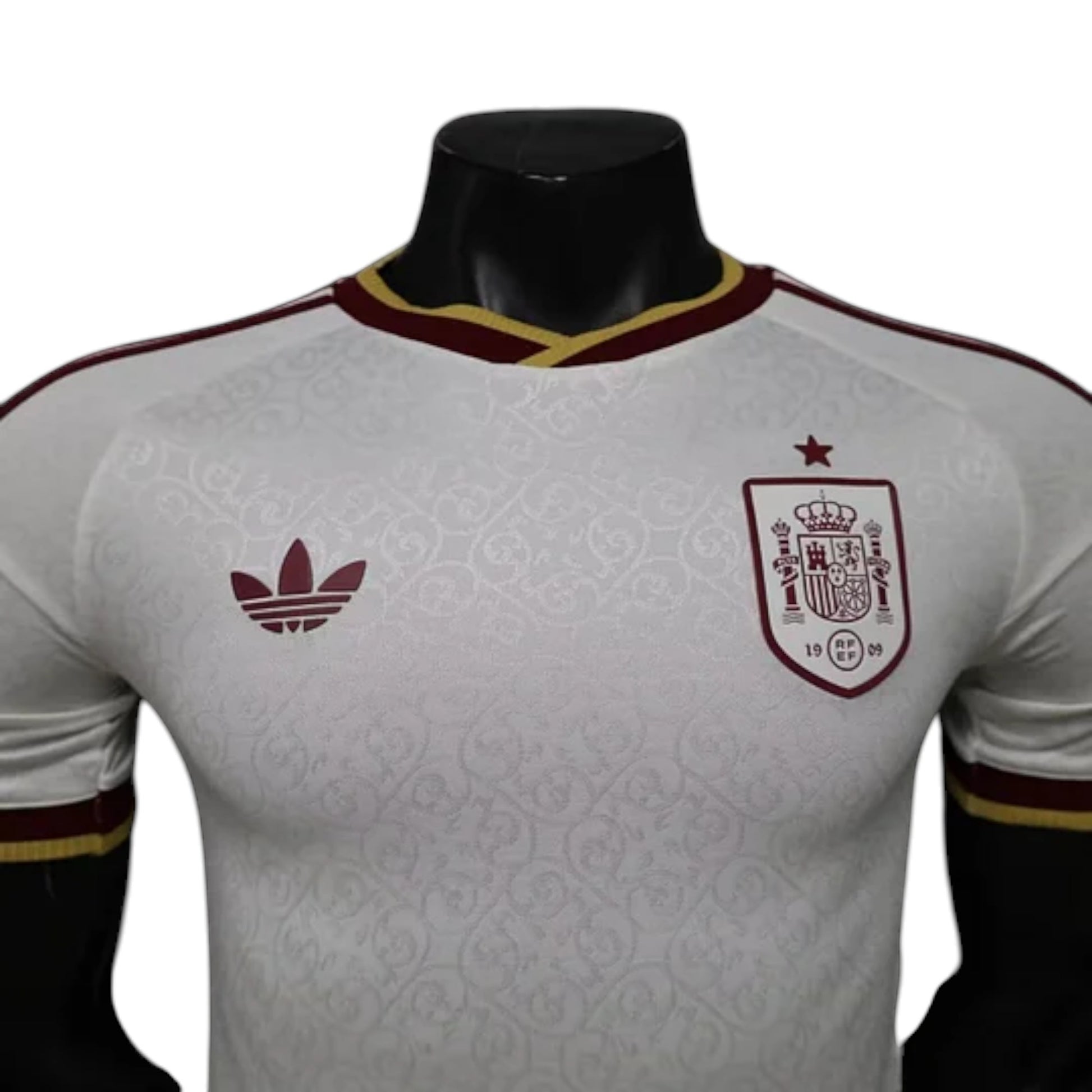 GOATkitz Spain 2026 player version away jersey in white with maroon and gold trim. Features crest and Adidas logo.