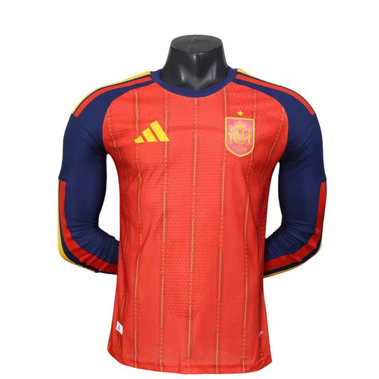 GOATkitz Spain 2026 long sleeve player version home jersey in red with blue sleeves and yellow accents. Customizable.