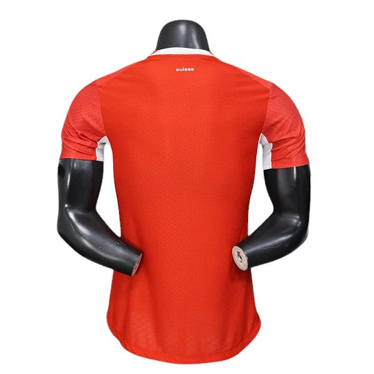 GOATkitz Switzerland 2026 player version home jersey, red with white accents on the sides and collar. Features a subtle textured pattern.