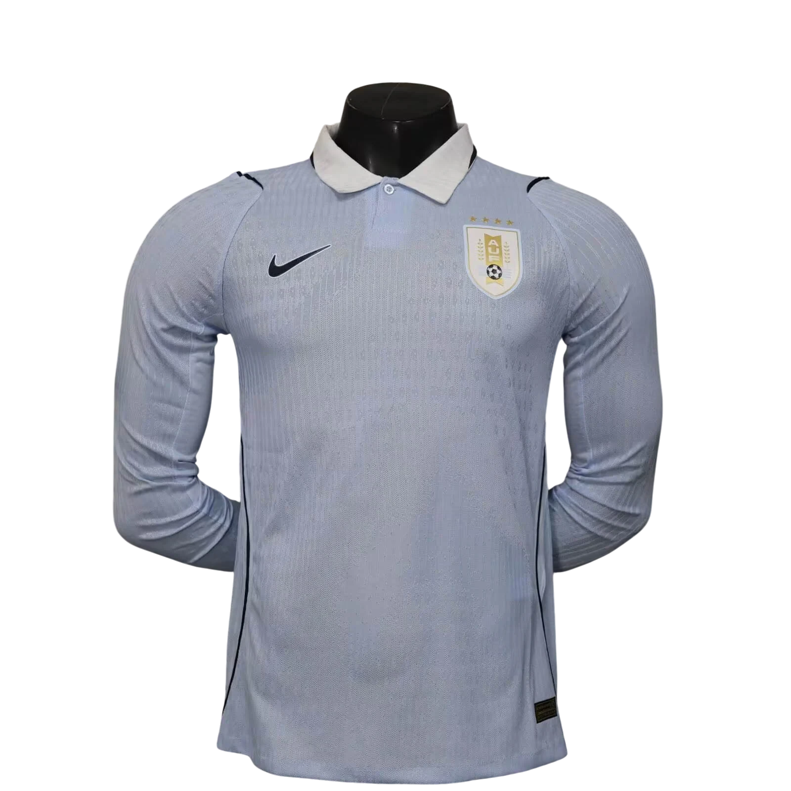 GOATkitz light blue Uruguay 2026 long sleeve player version soccer jersey with white collar and gold crest.