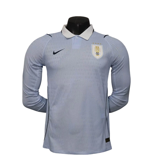 GOATkitz light blue Uruguay 2026 long sleeve player version soccer jersey with white collar and gold crest.