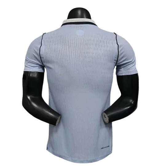 GOATkitz light blue Uruguay 2026 player version soccer jersey with black trim and pinstripe texture.