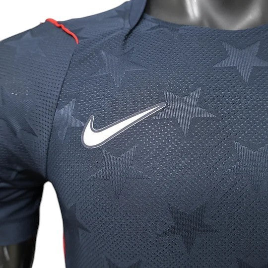 GOATkitz navy blue USA 2026 player version away jersey with white Nike swoosh and subtle star pattern.