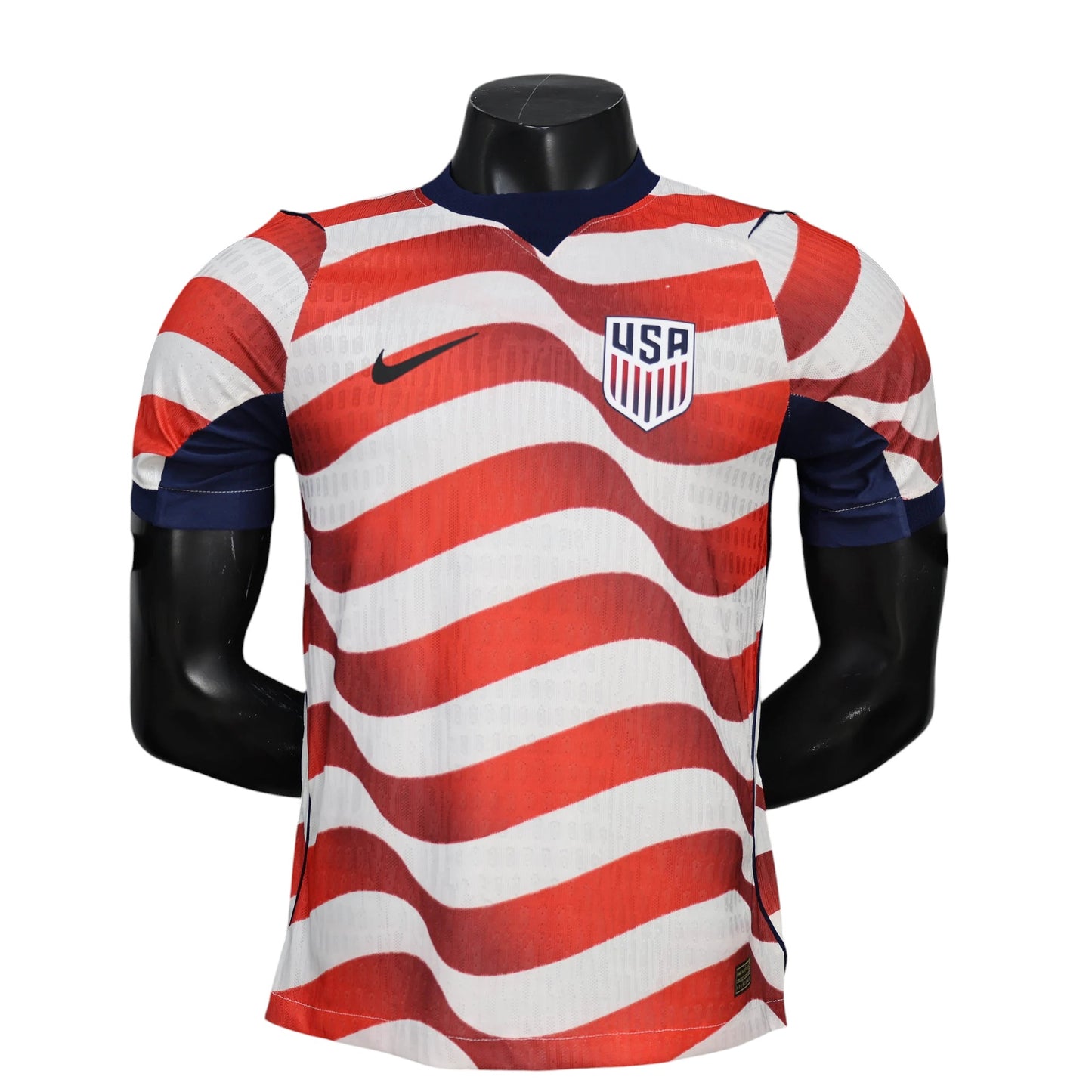 GOATkitz USA 2026 player version home jersey with red and white wavy stripes, navy collar and sleeves, and USA crest.