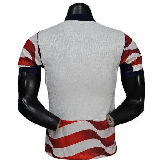 GOATkitz USA 2026 player version home jersey, white with red and blue wavy stripe accents on sleeves and hem.