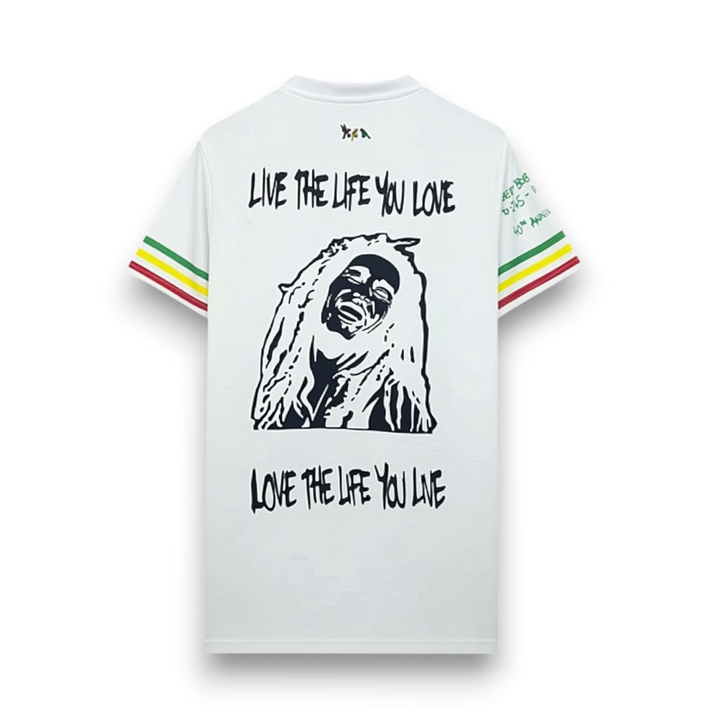 GOATkitz white t-shirt with Bob Marley graphic and "Live the life you love" text. Features red, yellow, and green striped sleeves.