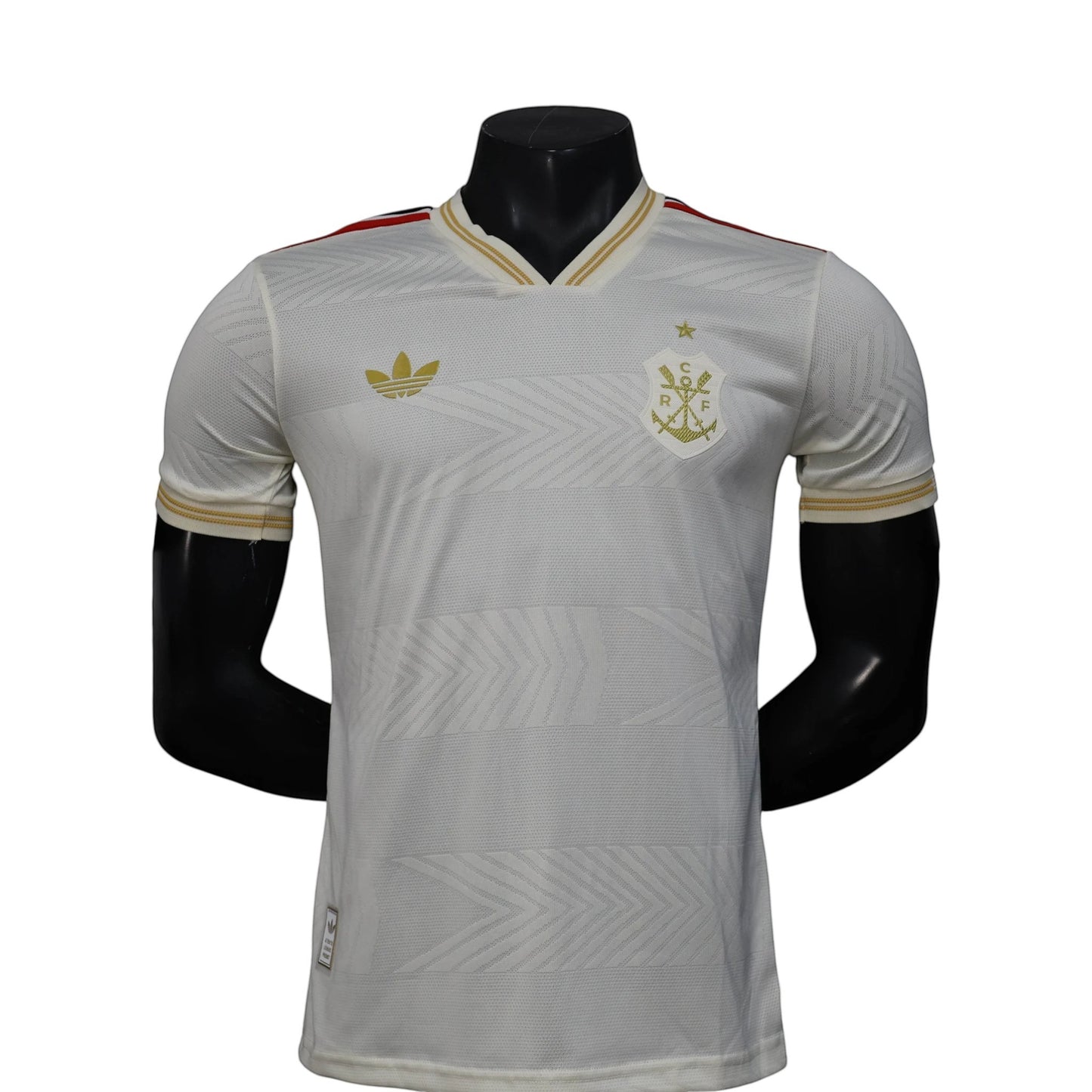 GOATkitz white Adidas soccer jersey with gold trim and crest, featuring a subtle chevron pattern. Player version, customizable.