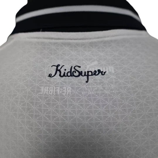 GOATkitz white player version jersey with navy collar and KidSuper logo. Customizable name and number.